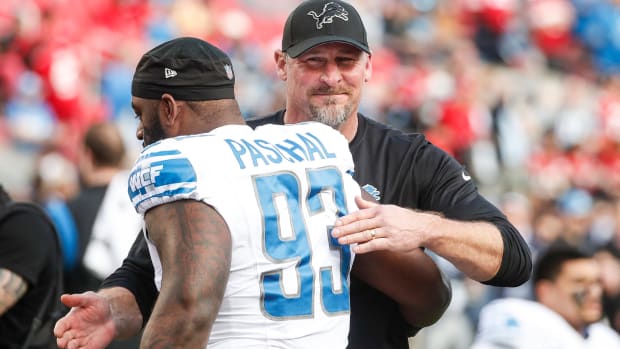 Lions coach Dan Campbell hugs defensive lineman Josh Paschal during warmups before the NFC championship game at Levi's Stadium in Santa Clara, California, on Sunday, Jan. 28, 2024.
